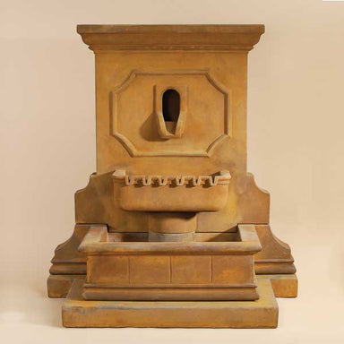 Savonna Wall Fountain with Step against brown background.