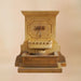 Savonna Wall Fountain with Step for Spout against brown background.