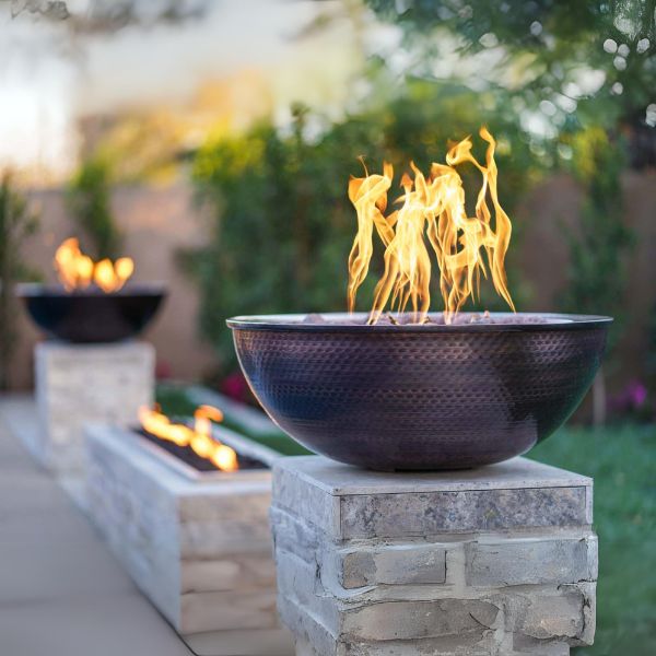 Sedona Copper Fire Bowl on ledge in the backyard