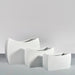 Seoul Modern Curved Rectangle Fiberglass Planter on concrete shown with three different sizes.