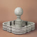 Sfera Fountain against brown background.