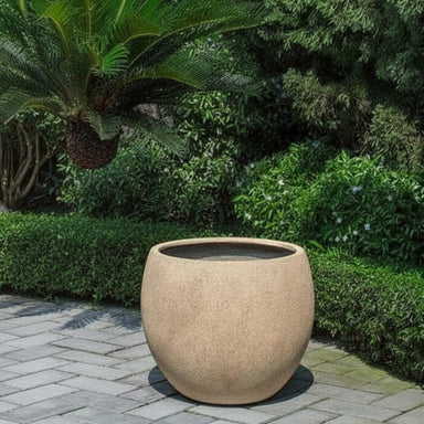 Sfera Planter, Medium filled with plants in the backyard.
