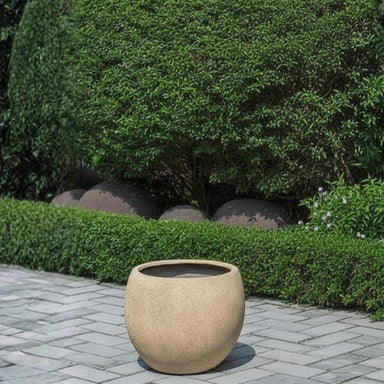 Sfera Planter, Small filled with plants in the backyard.