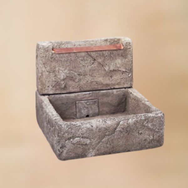 Shallow Cistern Fountain  with Copper Overflow against brown background.