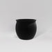 Shanghai Fishbowl Fiberglass Planter in matte black against gray background.