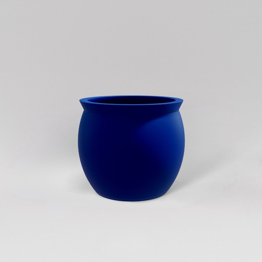 Shanghai Fishbowl Fiberglass Planter in matte cobalt blue against gray background.