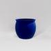 Shanghai Fishbowl Fiberglass Planter in matte cobalt blue against gray background.
