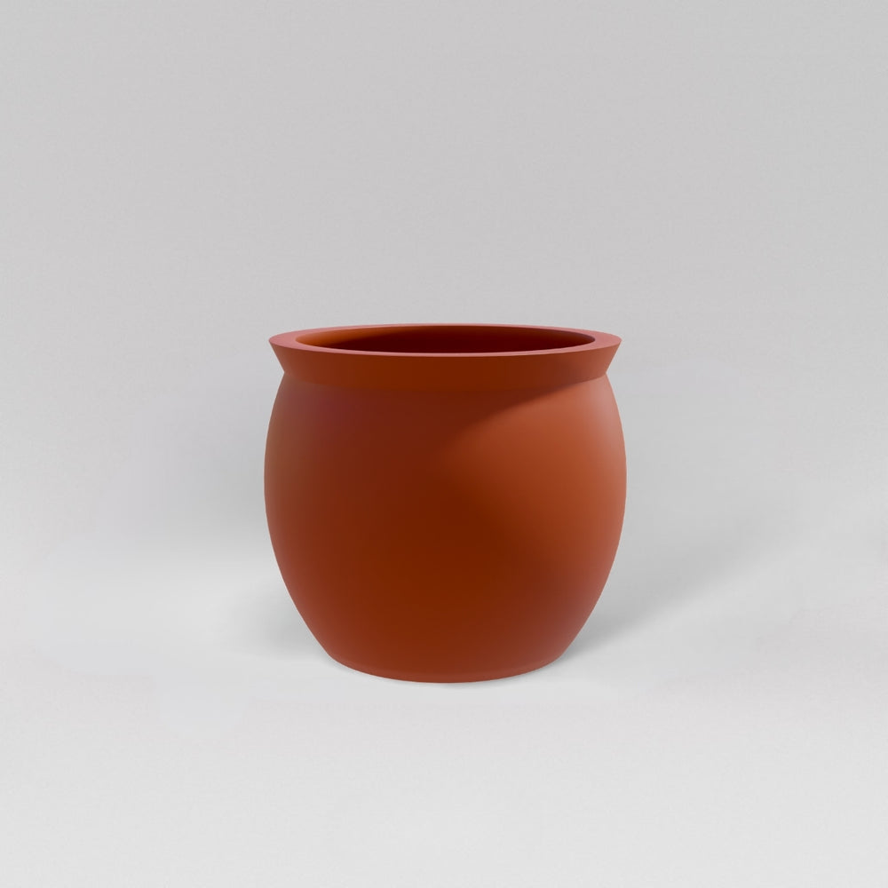 Shanghai Fishbowl Fiberglass Planter in matte terra cotta against gray background.