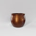 Shanghai Fishbowl Fiberglass Planter in metallic bronze against gray background.