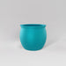 Shanghai Fishbowl Fiberglass Planter in satin seafoam green against gray background.