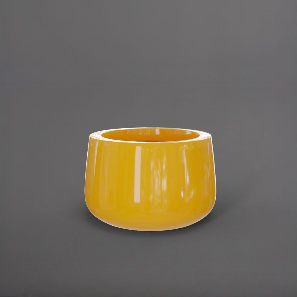 Short Hayden Tapered Round Fiberglass Planter in gloss saffron against gray background.
