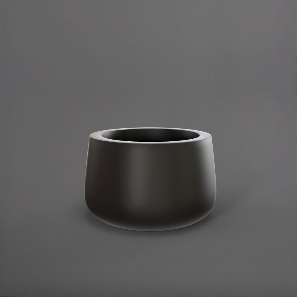 Short Hayden Tapered Round Fiberglass Planter in matte black against gray background.