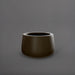 Short Hayden Tapered Round Fiberglass Planter in matte bronze against gray background.