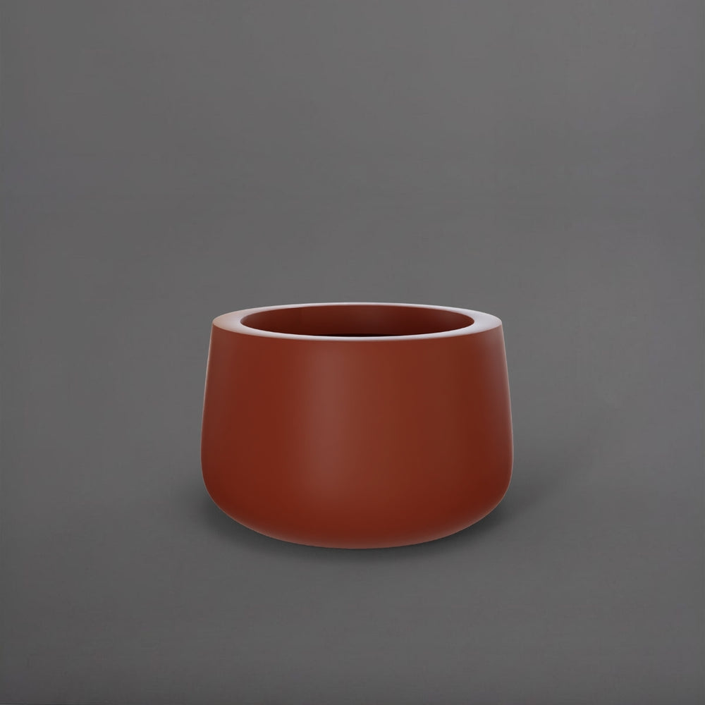 Short Hayden Tapered Round Fiberglass Planter in matte terra cotta against gray background.