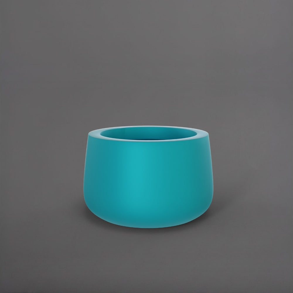 Short Hayden Tapered Round Fiberglass Planter in satin seafoam green against gray background.