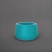 Short Hayden Tapered Round Fiberglass Planter in satin seafoam green against gray background.