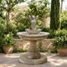 Sirena Mermaid Fountain surrounded with lush greenery plants