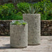 Siros Planter, Tall on concrete filled with plants