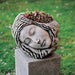 Sleeping Maiden Planter filled with plants in the backyard