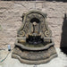 Sonoma Wall Fountain for spout in action against brick wall.