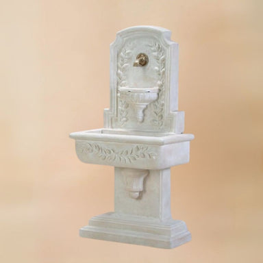 Sorrentine Wall Fountain for spout against brown background.
