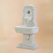 Sorrentine Wall Fountain for spout against brown background.