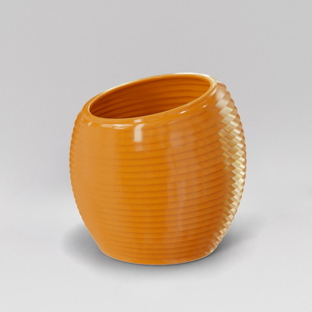 Spiral Globe Fiberglass Planter in gloss tangerine against gray background.