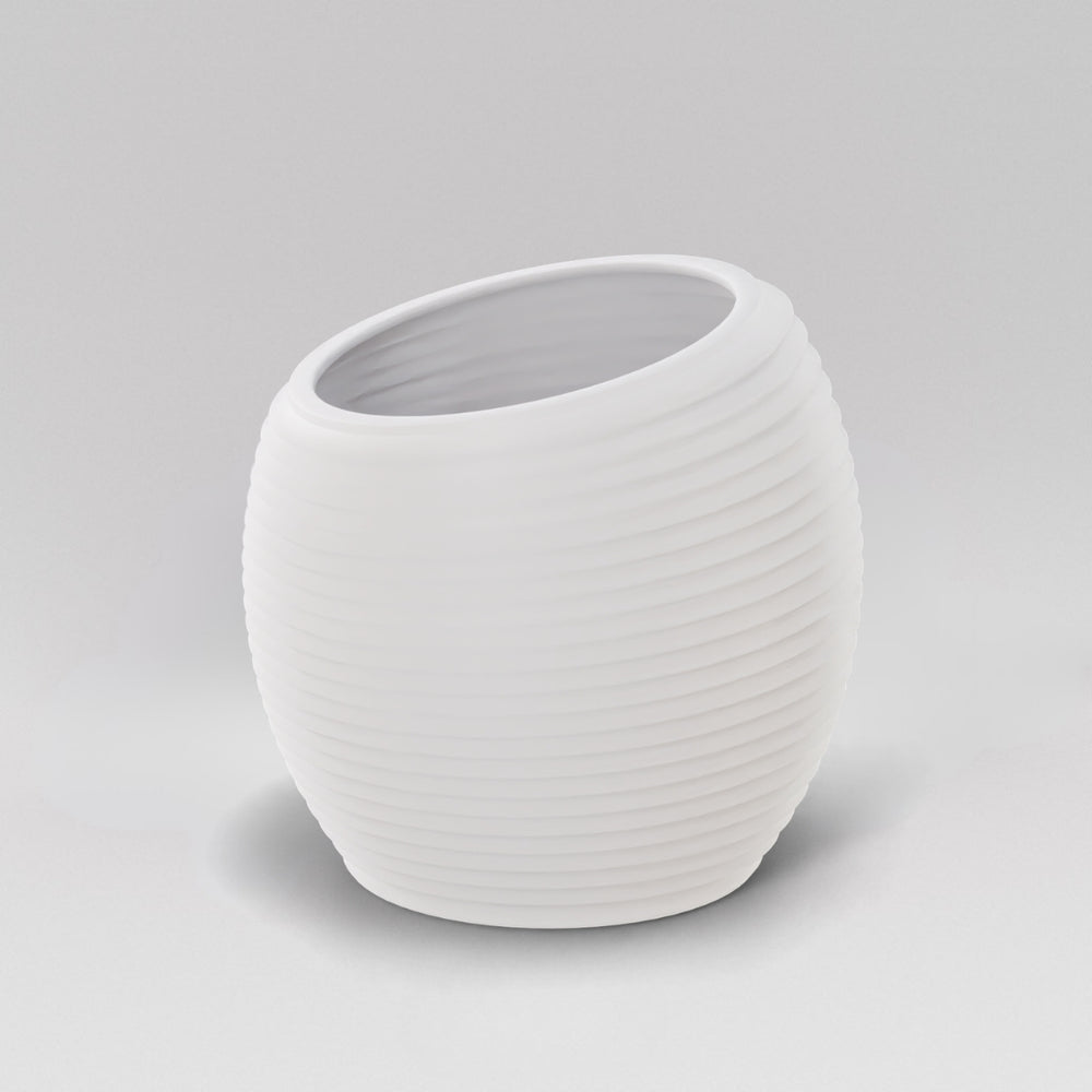 Spiral Globe Fiberglass Planter in matte bright white against gray background.