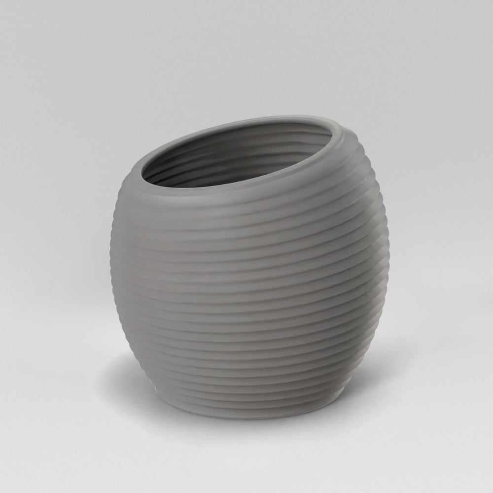 Spiral Globe Fiberglass Planter in matte cement grey against gray background.