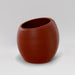 Spiral Globe Fiberglass Planter in matte terra cotta against gray background.