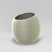 Spiral Globe Fiberglass Planter in satin beige against gray background.