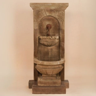 St. Helena Fountain with step against brown background.