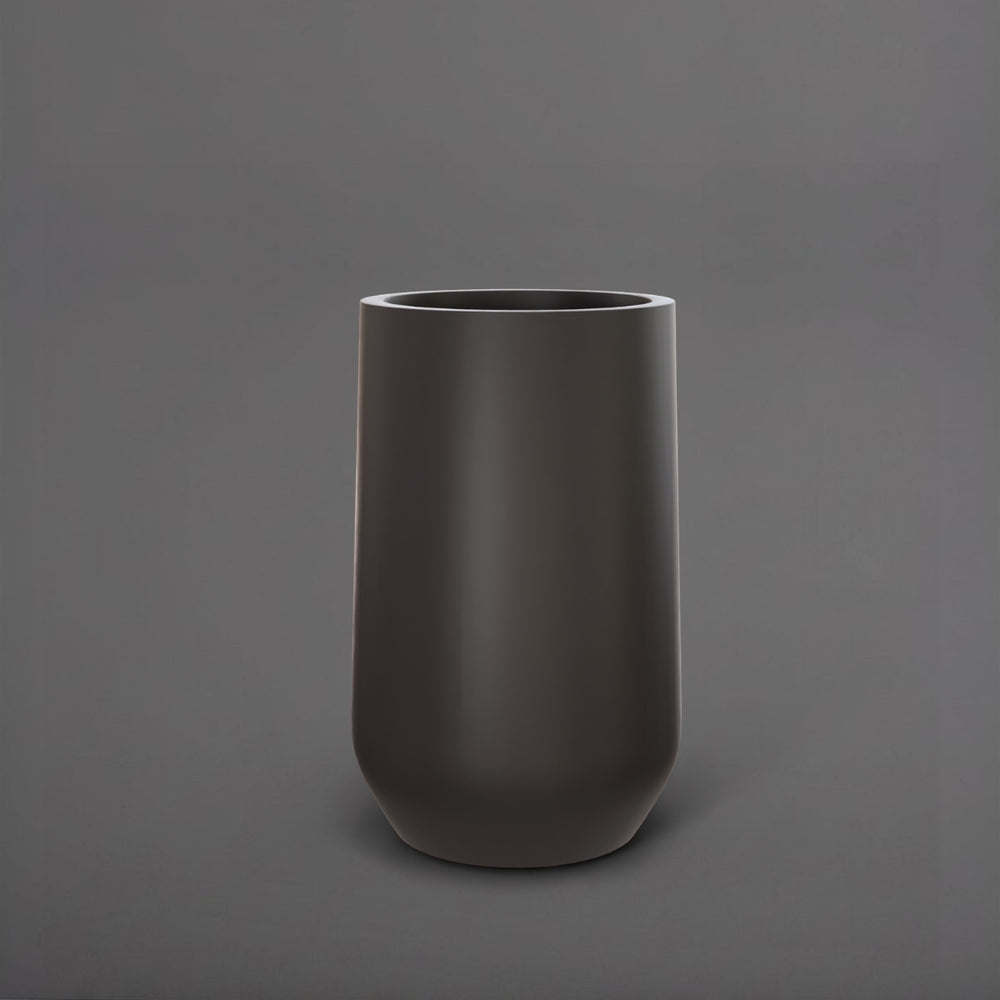 Tall Hayden Tapered Round Fiberglass Planter in matte charcoal against gray background.