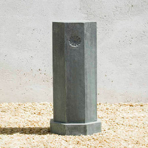 Tall Octagonal Pedestal on gravel in the backyard