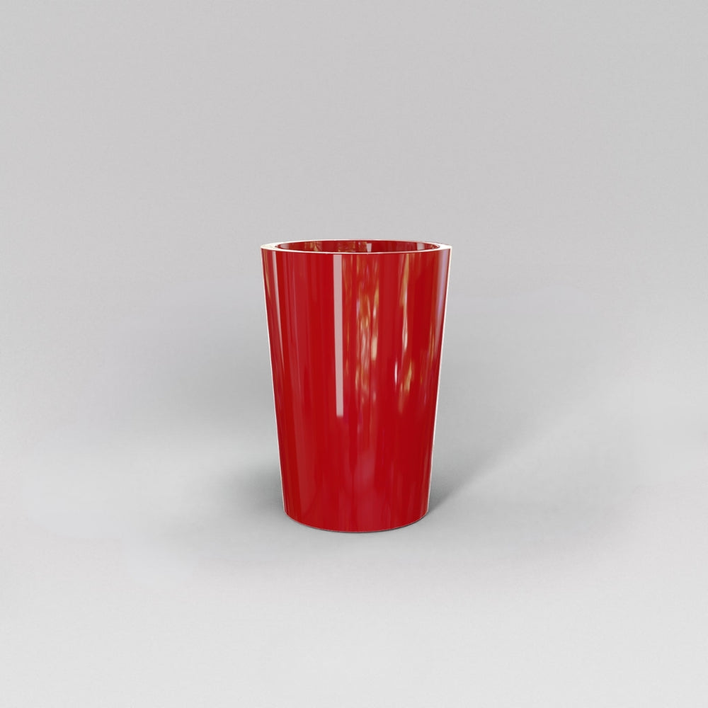 Tagel Tapered Round Fiberglass Planter in gloss red against gray background.
