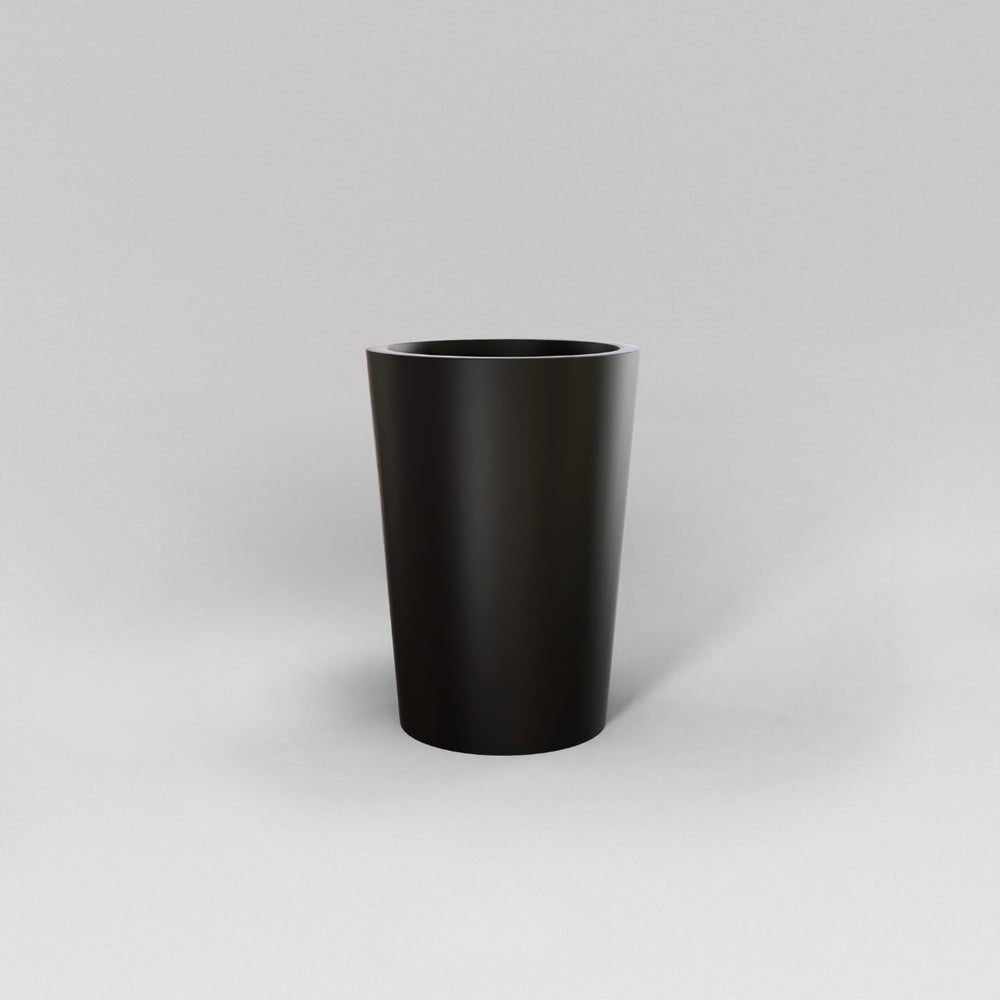 Tagel Tapered Round Fiberglass Planter in matte black against gray background.