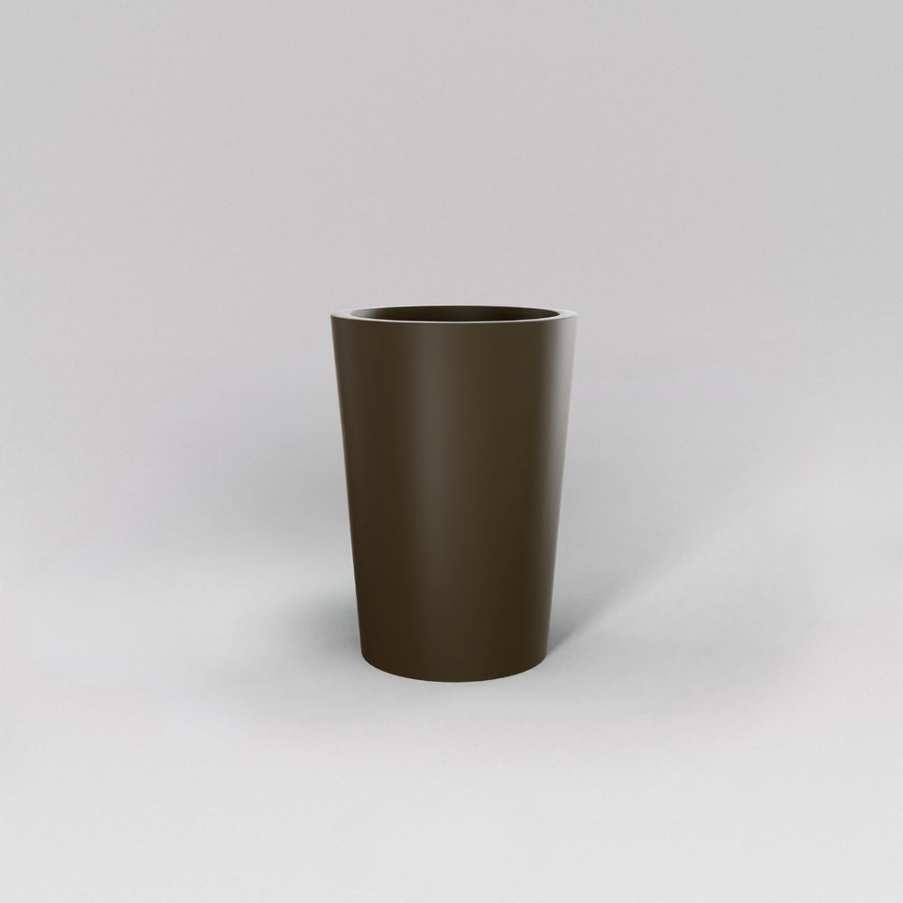Tagel Tapered Round Fiberglass Planter in matte bronze against gray background.