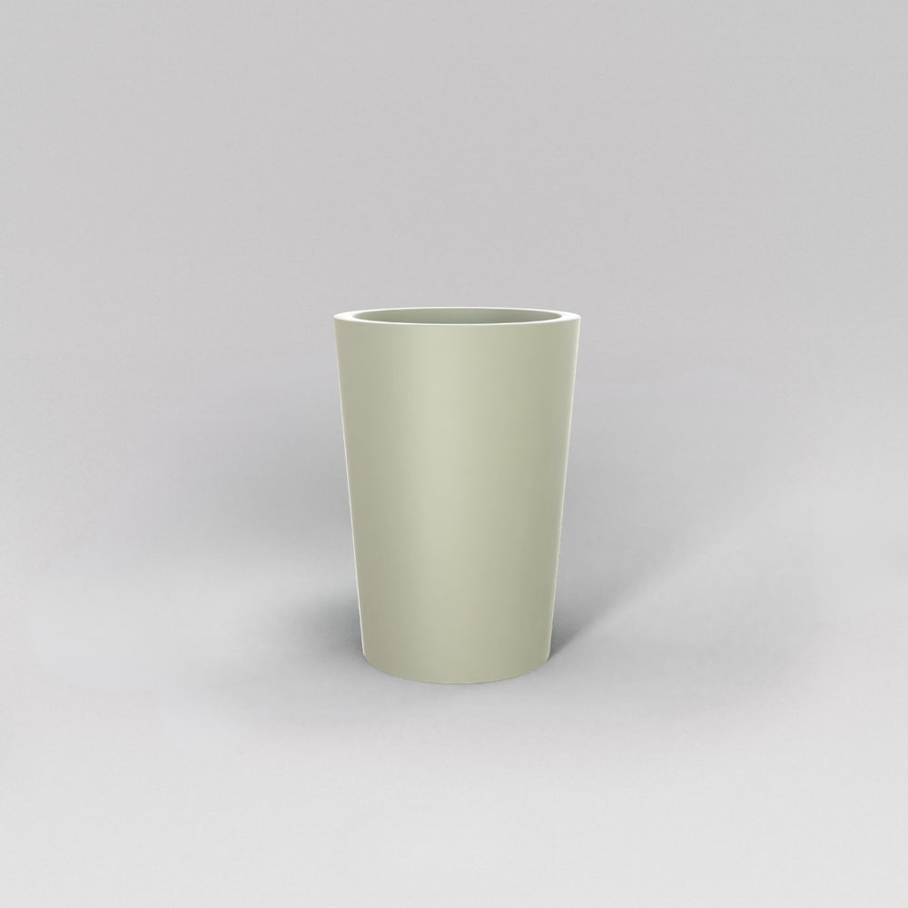 Tagel Tapered Round Fiberglass Planter in satin beige against gray background.