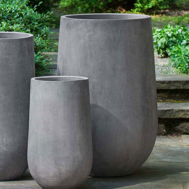 Telluride Planter, Tall in Grey in the backyard