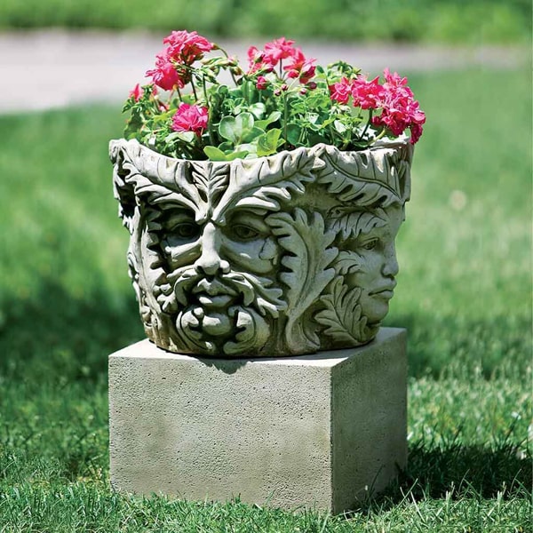 Textured Sm Low Sq Pedestal on grass filled with pink flowers