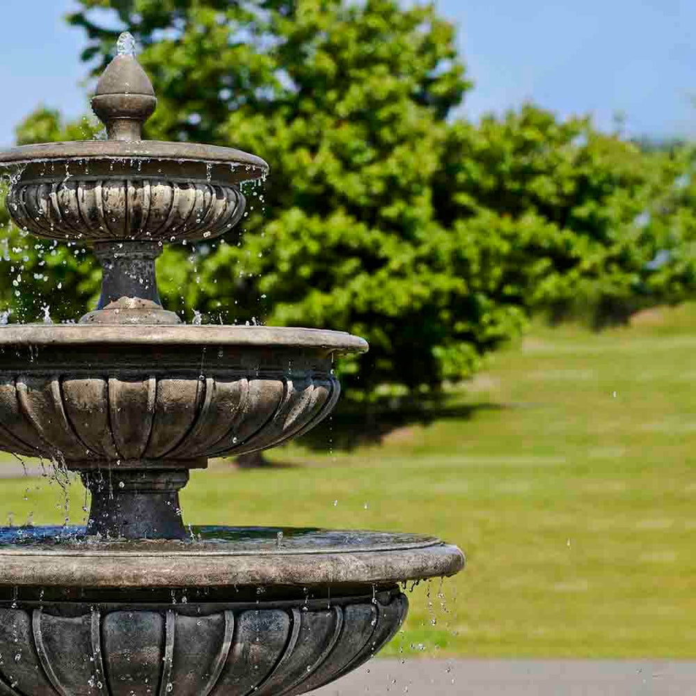 Three Tier Longvue Fountain in action on grass upclose.