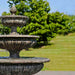 Three Tier Longvue Fountain in action on grass upclose.