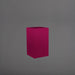 Tolga Corner Fiberglass Planter in gloss eggplant against gray background.
