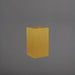 Tolga Corner Fiberglass Planter in gloss metallic gold against gray background.