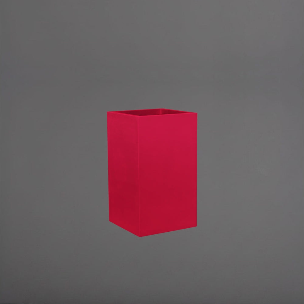 Tolga Corner Fiberglass Planter in gloss red against gray background.