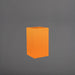 Tolga Corner Fiberglass Planter in gloss tangerine against gray background.