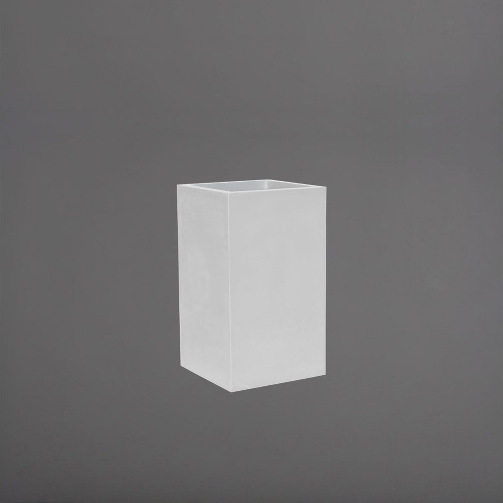 Tolga Corner Fiberglass Planter in matte bright white against gray background.