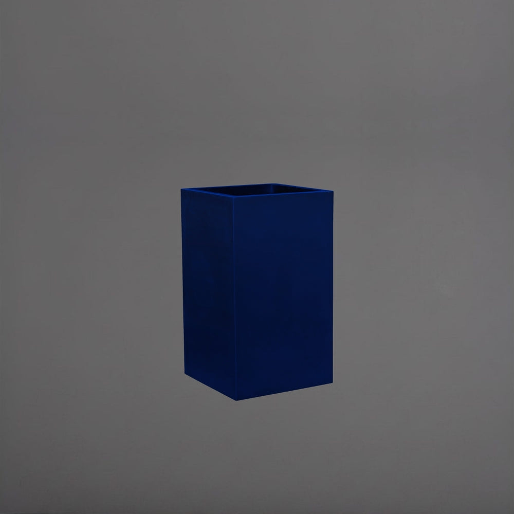 Tolga Corner Fiberglass Planter in matte cobalt blue against gray background