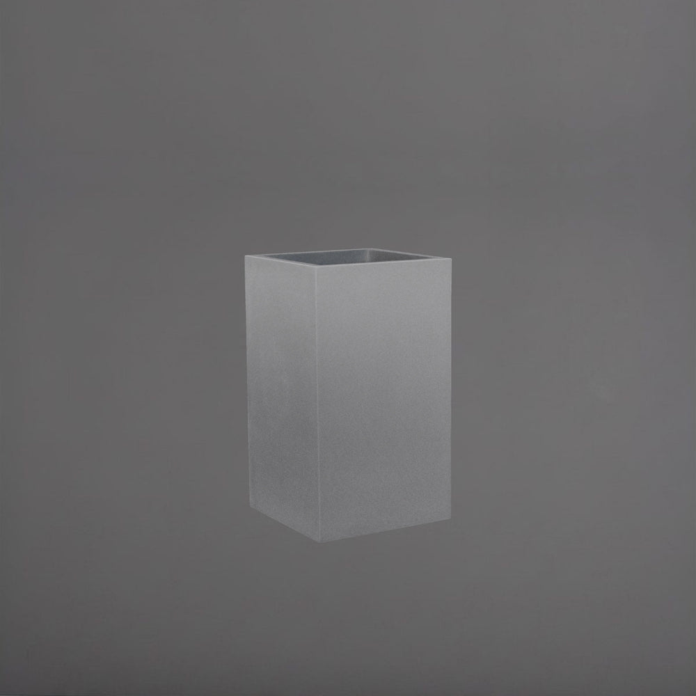 Tolga Corner Fiberglass Planter in matte gunmetal against gray background.