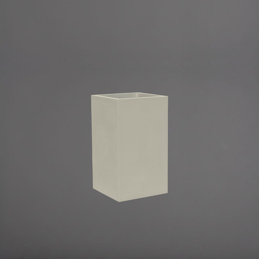  Tolga Corner Fiberglass Planter in satin beige against gray background.